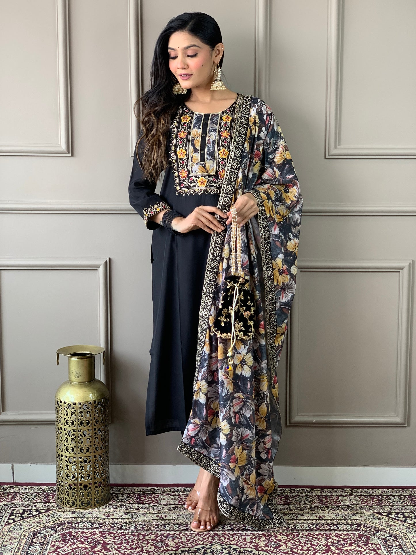 Discover elegance with our beautifully designed black embroidered outfit, featuring intricate floral patterns and a matching dupatta.