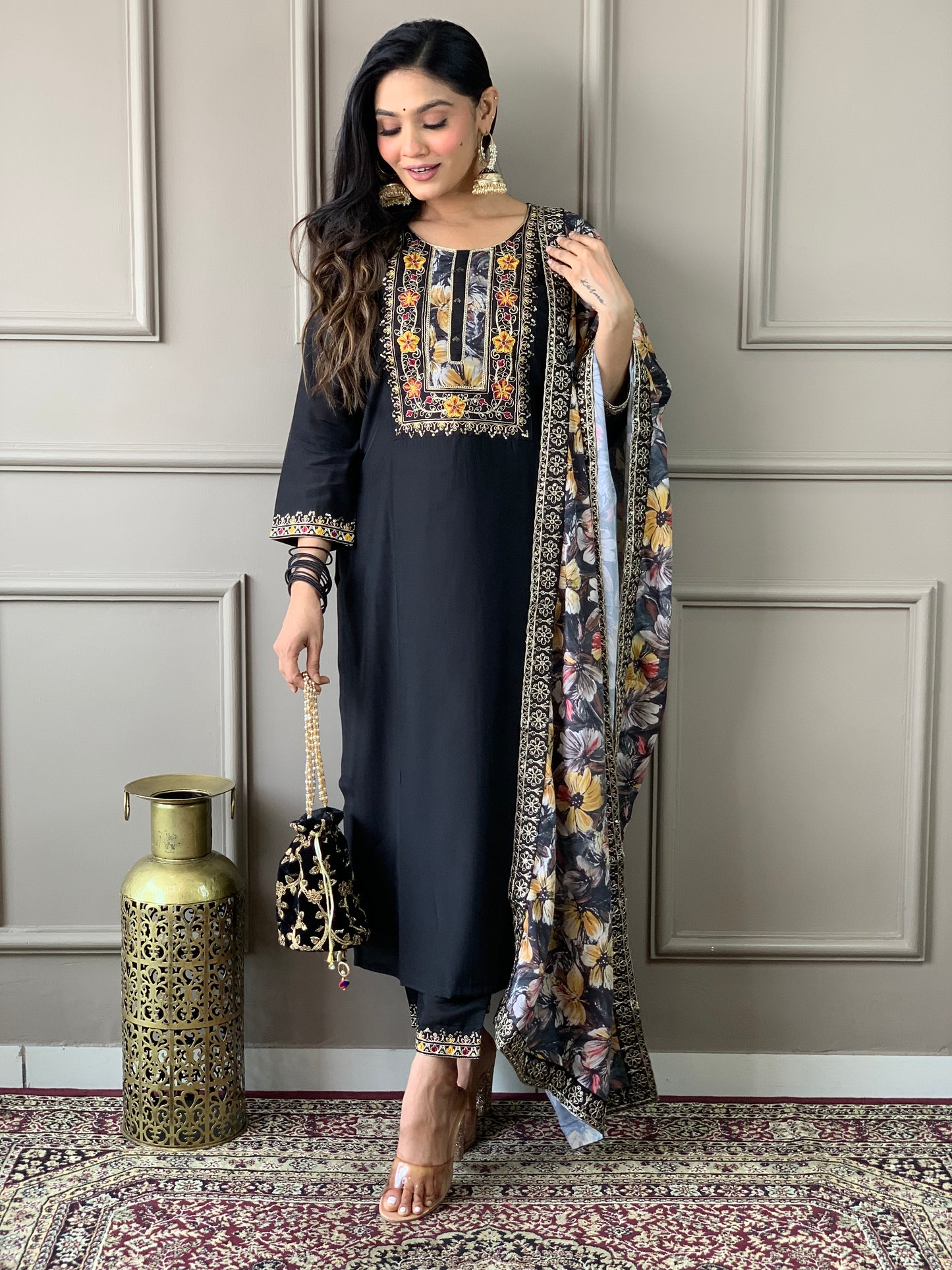 Discover elegance with our beautifully designed black embroidered outfit, featuring intricate floral patterns and a matching dupatta.