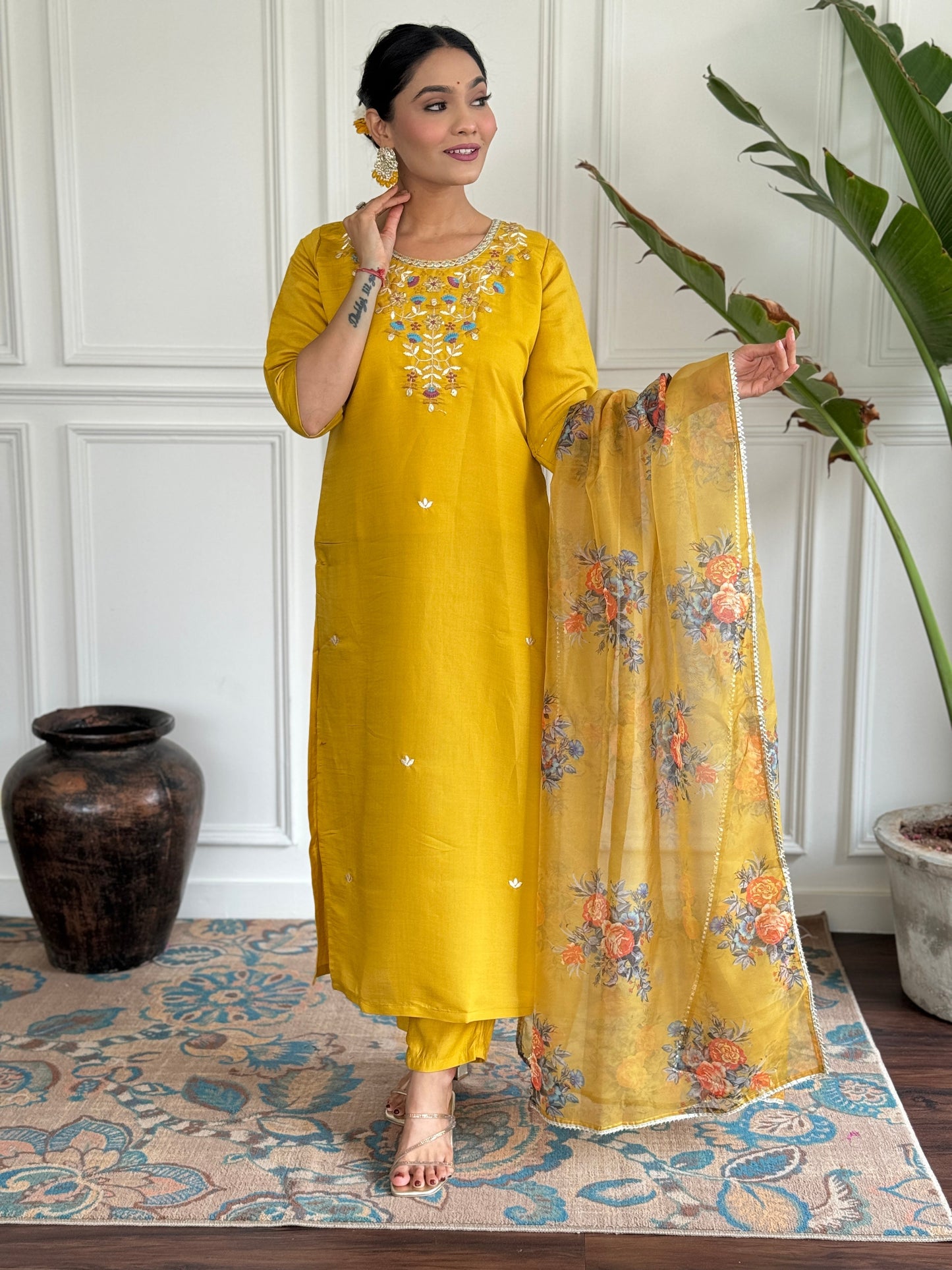 Brighten up your wardrobe with this radiant yellow kurti set, adorned with delicate floral embroidery and a sheer, printed dupatta
