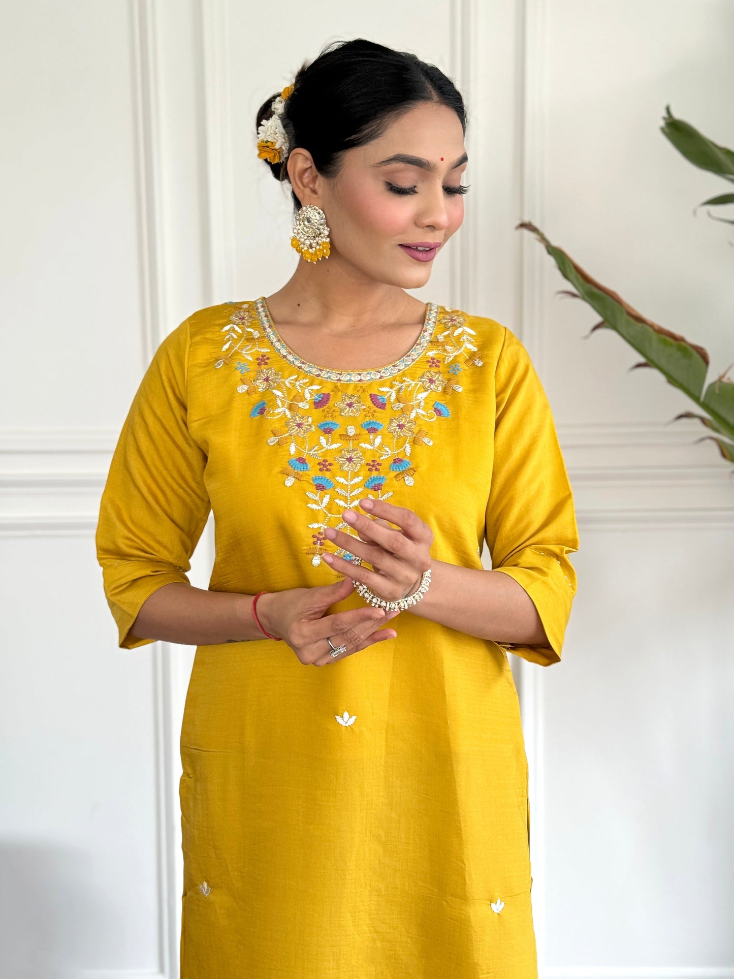 Brighten up your wardrobe with this radiant yellow kurti set, adorned with delicate floral embroidery and a sheer, printed dupatta