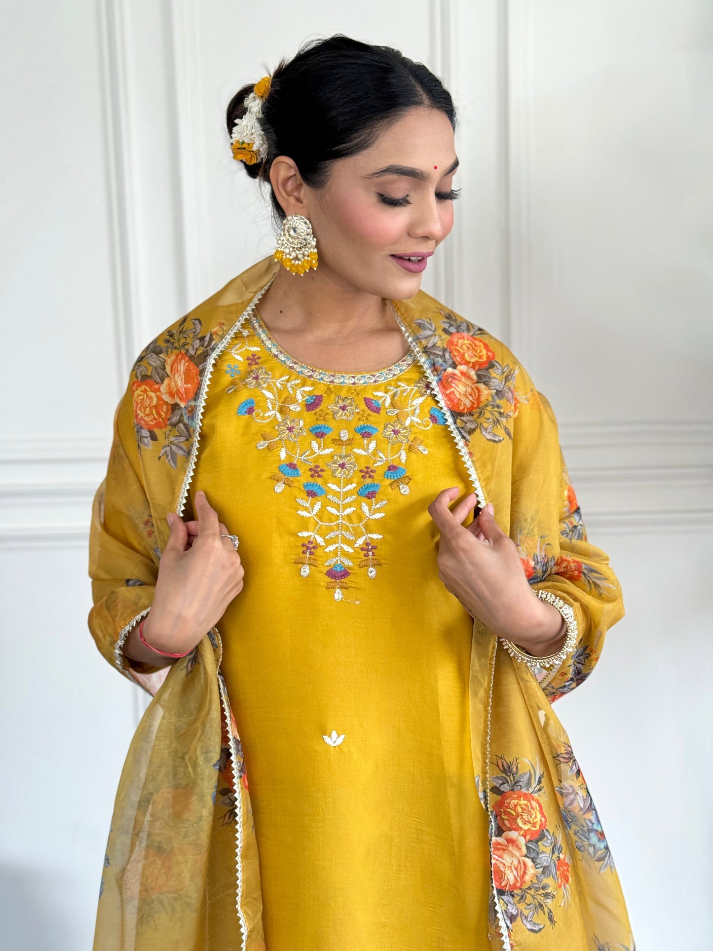 Brighten up your wardrobe with this radiant yellow kurti set, adorned with delicate floral embroidery and a sheer, printed dupatta
