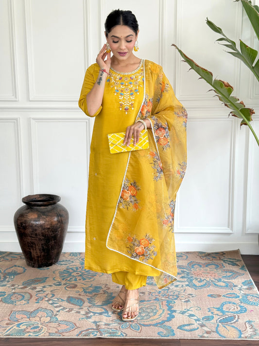 Brighten up your wardrobe with this radiant yellow kurti set, adorned with delicate floral embroidery and a sheer, printed dupatta