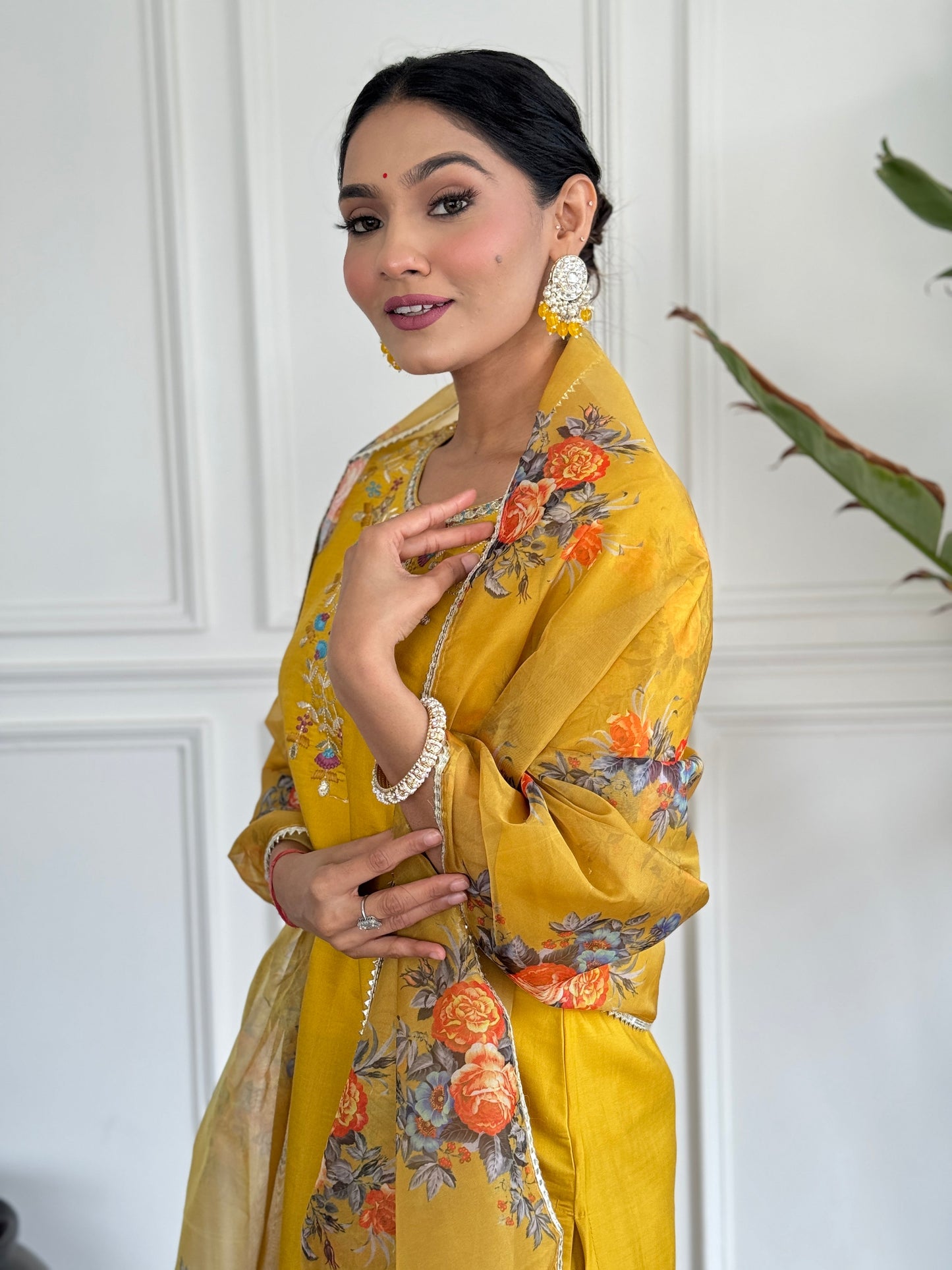 Brighten up your wardrobe with this radiant yellow kurti set, adorned with delicate floral embroidery and a sheer, printed dupatta