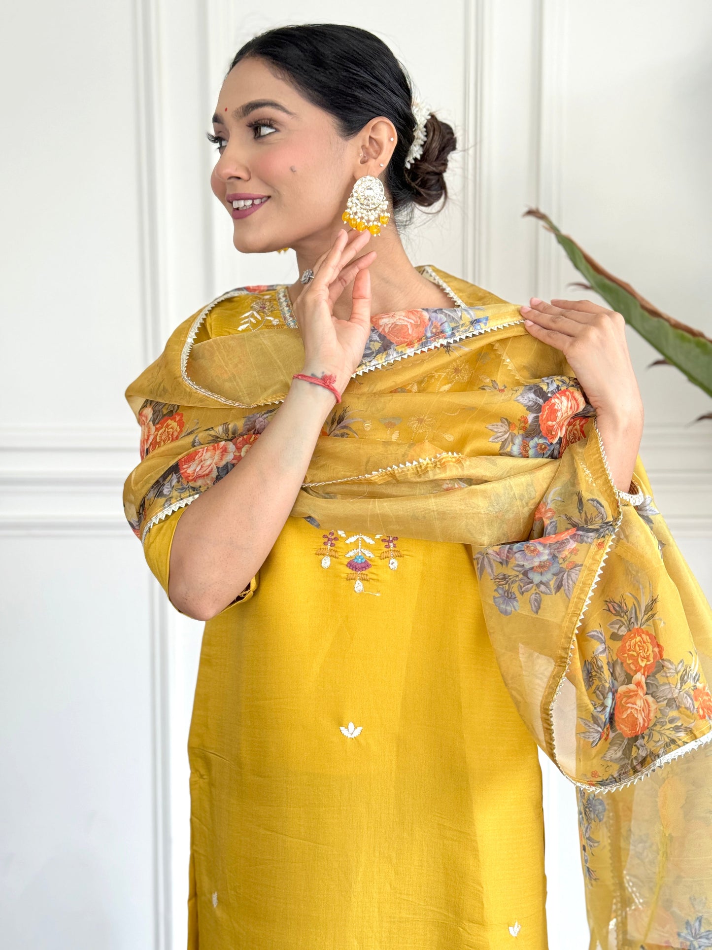 Brighten up your wardrobe with this radiant yellow kurti set, adorned with delicate floral embroidery and a sheer, printed dupatta