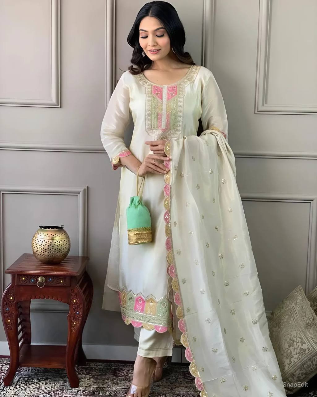 Elevate your elegance with this stunning off-white embroidered Kurti set. Adorned with delicate pink and gold accents, it features intricate detailing, a graceful dupatta