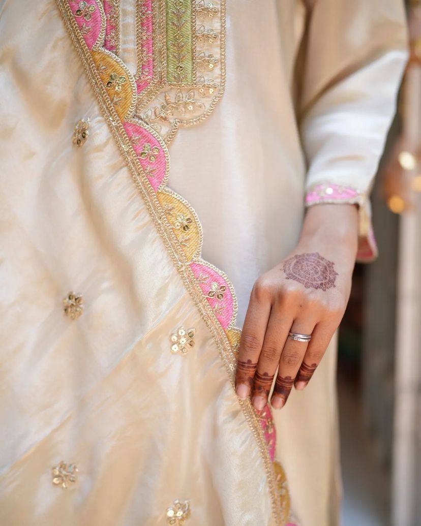 Elevate your elegance with this stunning off-white embroidered Kurti set. Adorned with delicate pink and gold accents, it features intricate detailing, a graceful dupatta
