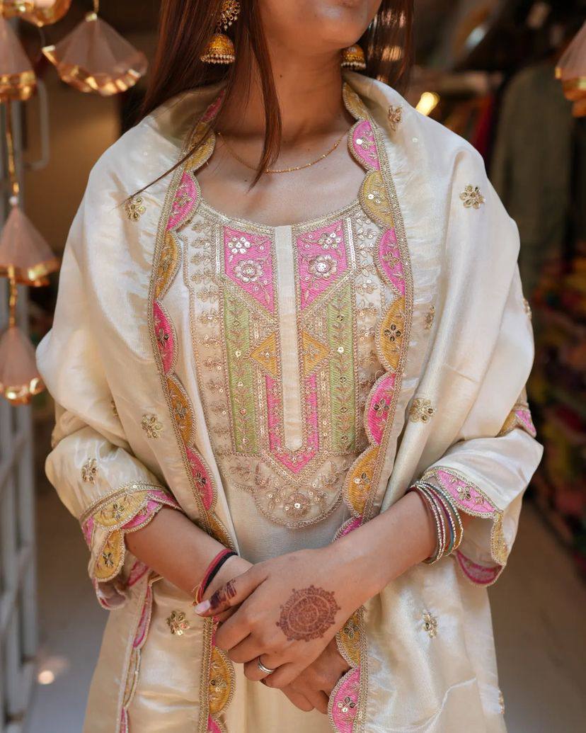 Elevate your elegance with this stunning off-white embroidered Kurti set. Adorned with delicate pink and gold accents, it features intricate detailing, a graceful dupatta