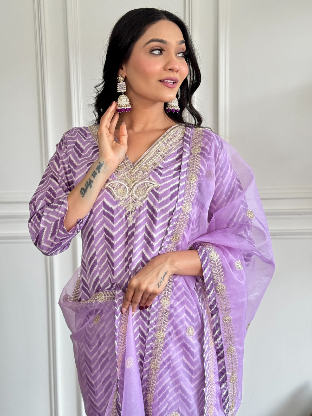 Step into elegance with this dreamy lavender kurti set, featuring intricate embroidery and a sheer, gold-accented dupatta