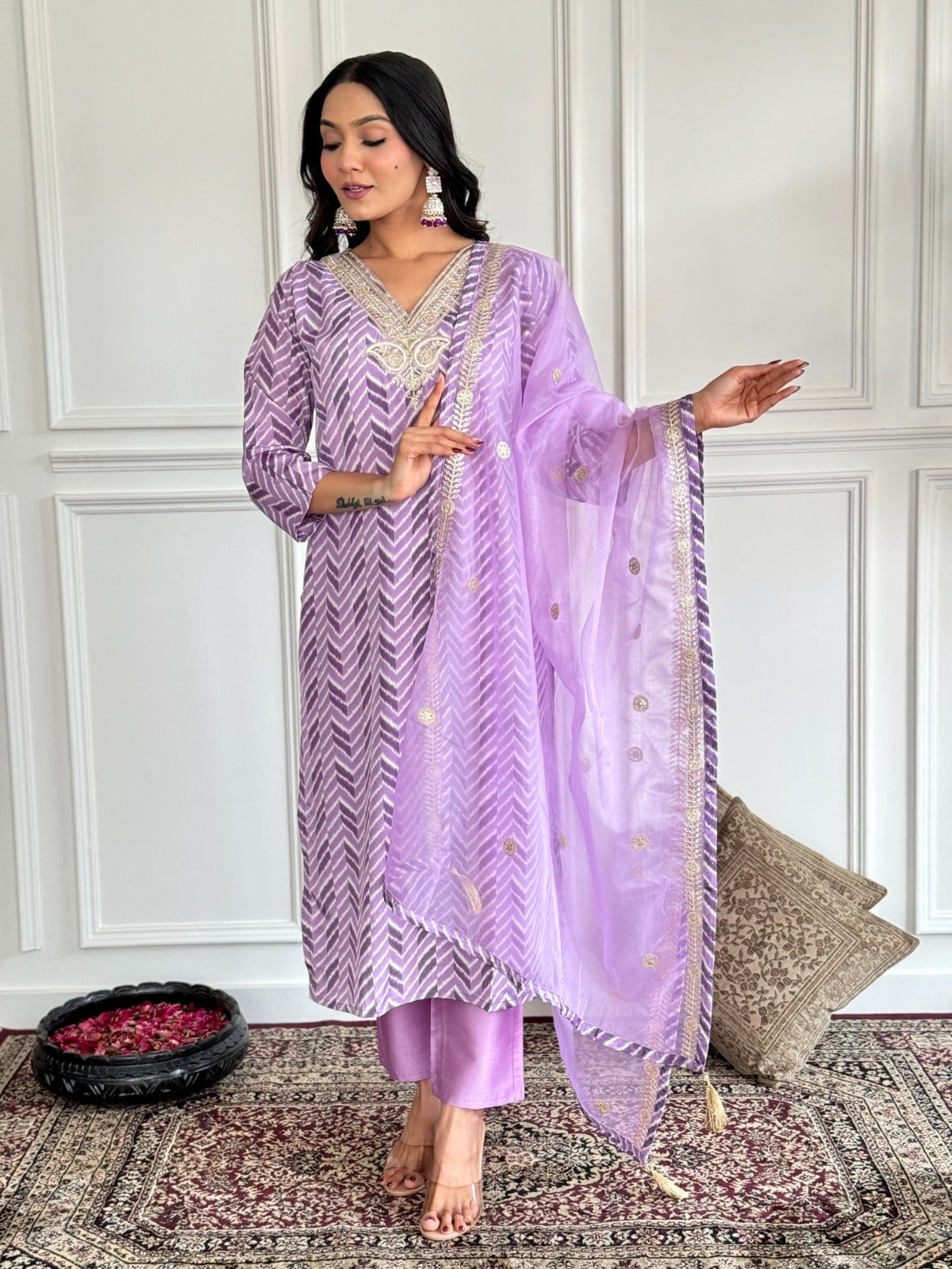 Step into elegance with this dreamy lavender kurti set, featuring intricate embroidery and a sheer, gold-accented dupatta