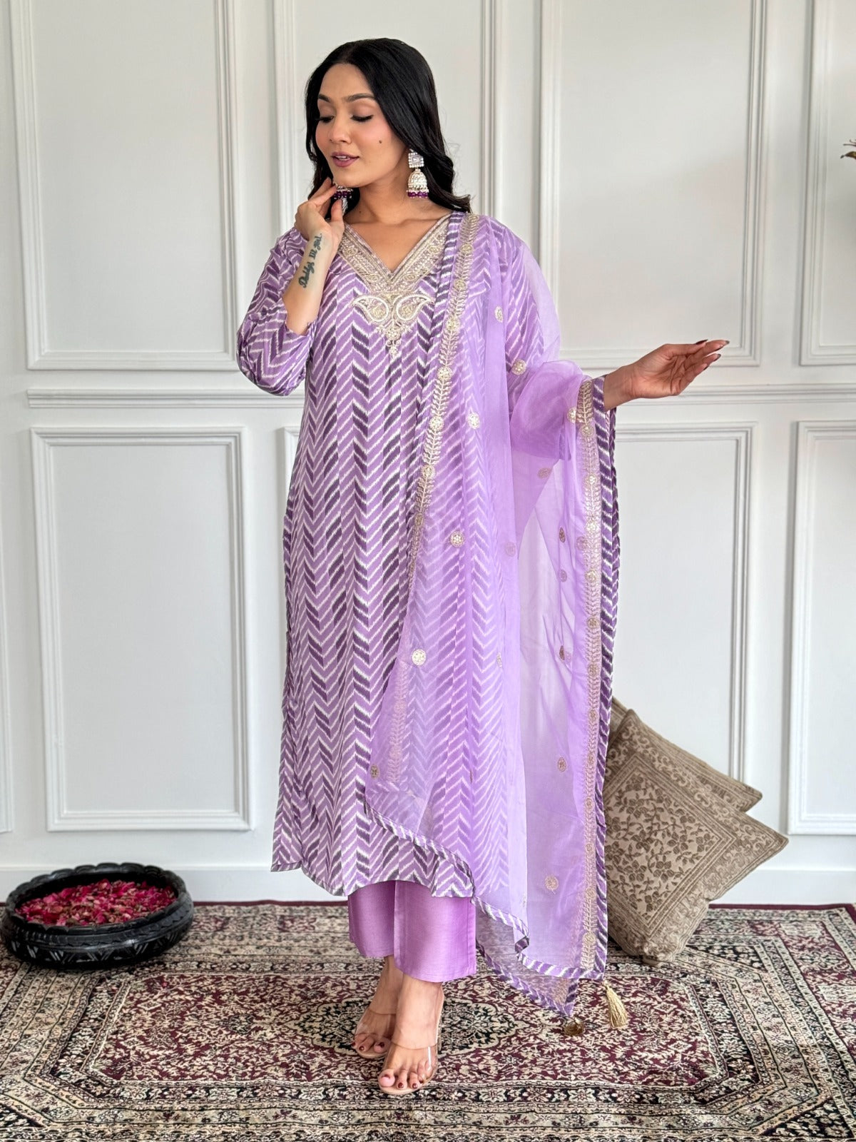 Step into elegance with this dreamy lavender kurti set, featuring intricate embroidery and a sheer, gold-accented dupatta