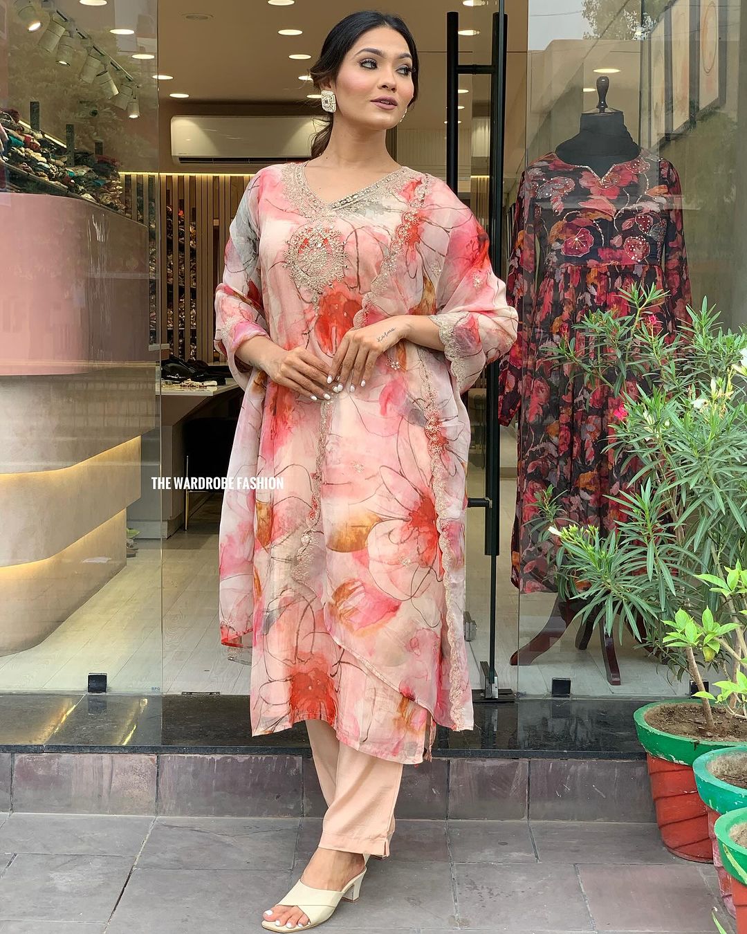 Elevate your style with this stunning floral-printed kurti set. Designed in soft pastel hues with delicate embroidery, it exudes elegance and charm