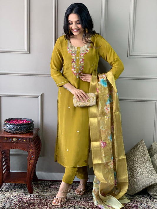 Elevate your style with this stunning mustard-yellow kurti set, featuring intricate floral embroidery and a delicate neckline design