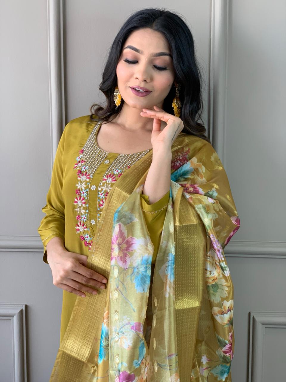 Elevate your style with this stunning mustard-yellow kurti set, featuring intricate floral embroidery and a delicate neckline design