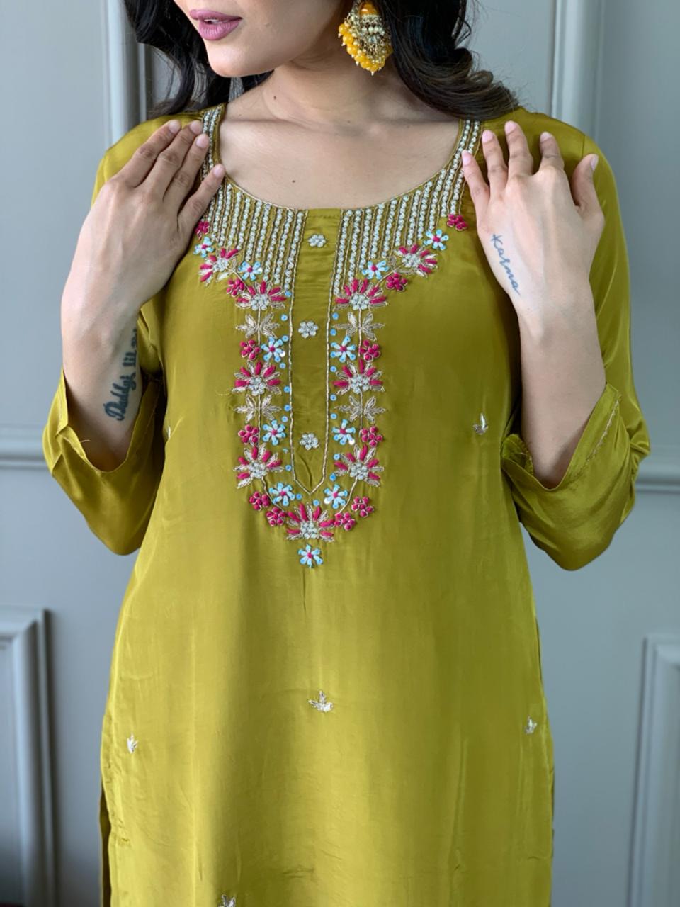 Elevate your style with this stunning mustard-yellow kurti set, featuring intricate floral embroidery and a delicate neckline design