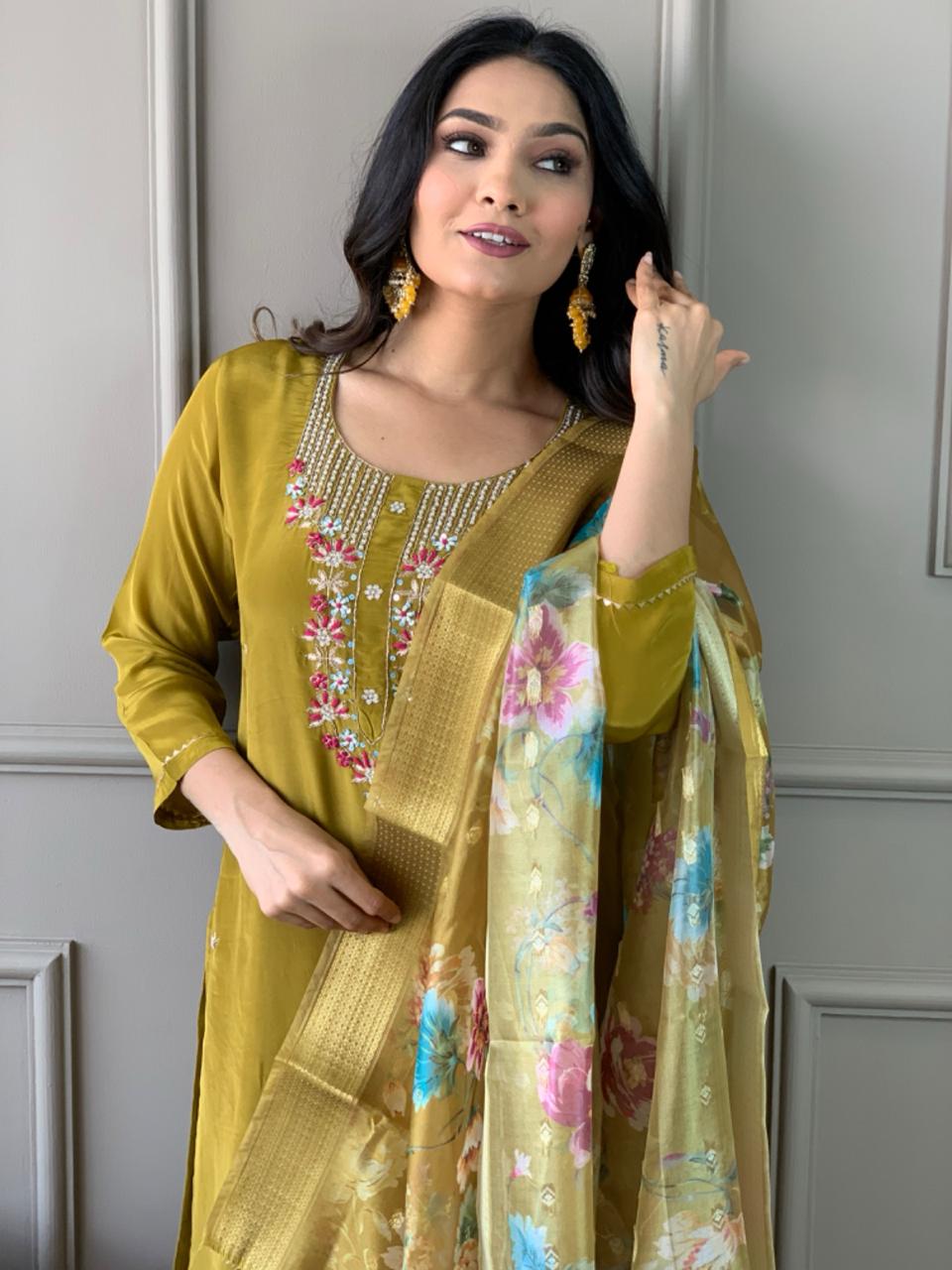Elevate your style with this stunning mustard-yellow kurti set, featuring intricate floral embroidery and a delicate neckline design