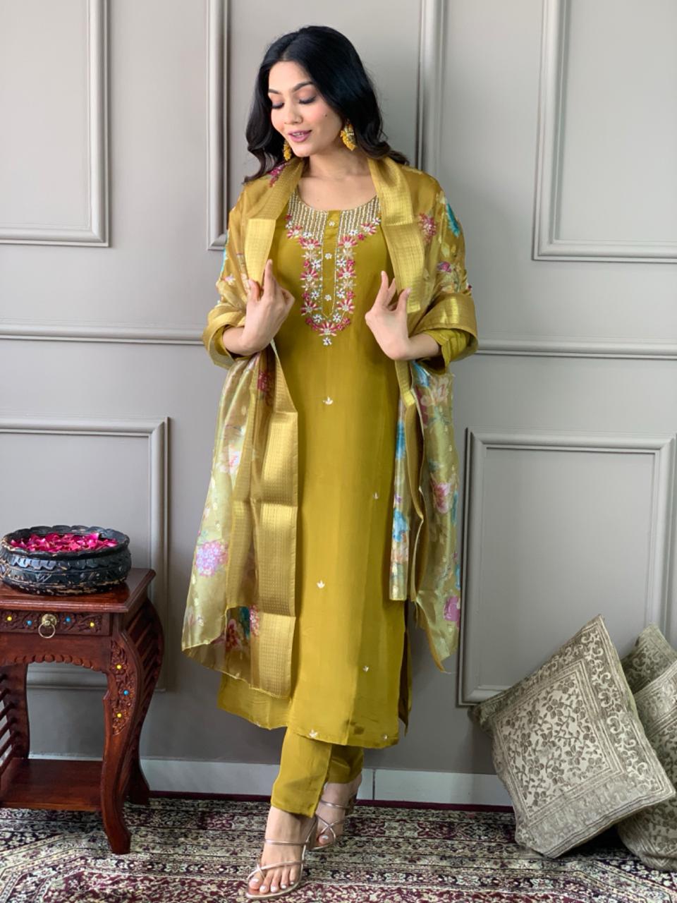 Elevate your style with this stunning mustard-yellow kurti set, featuring intricate floral embroidery and a delicate neckline design