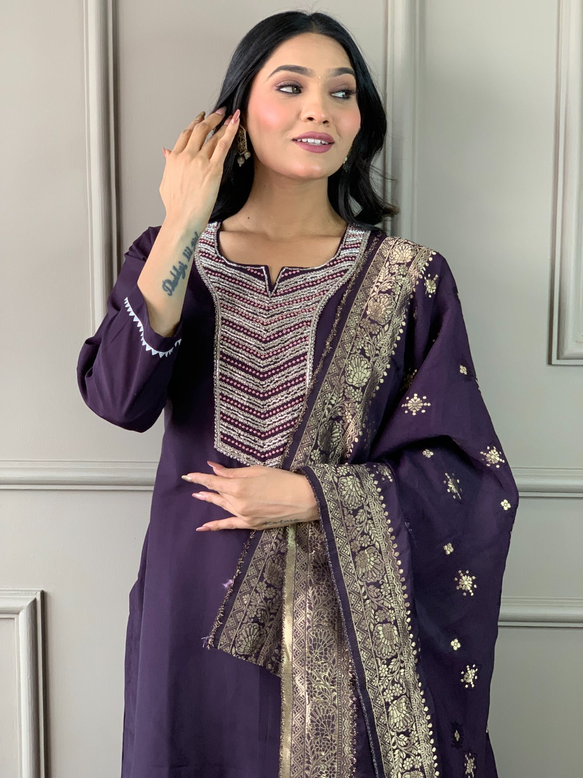 Exude elegance in this deep plum kurti set, featuring exquisite embroidery and a rich gold-detailed dupatta