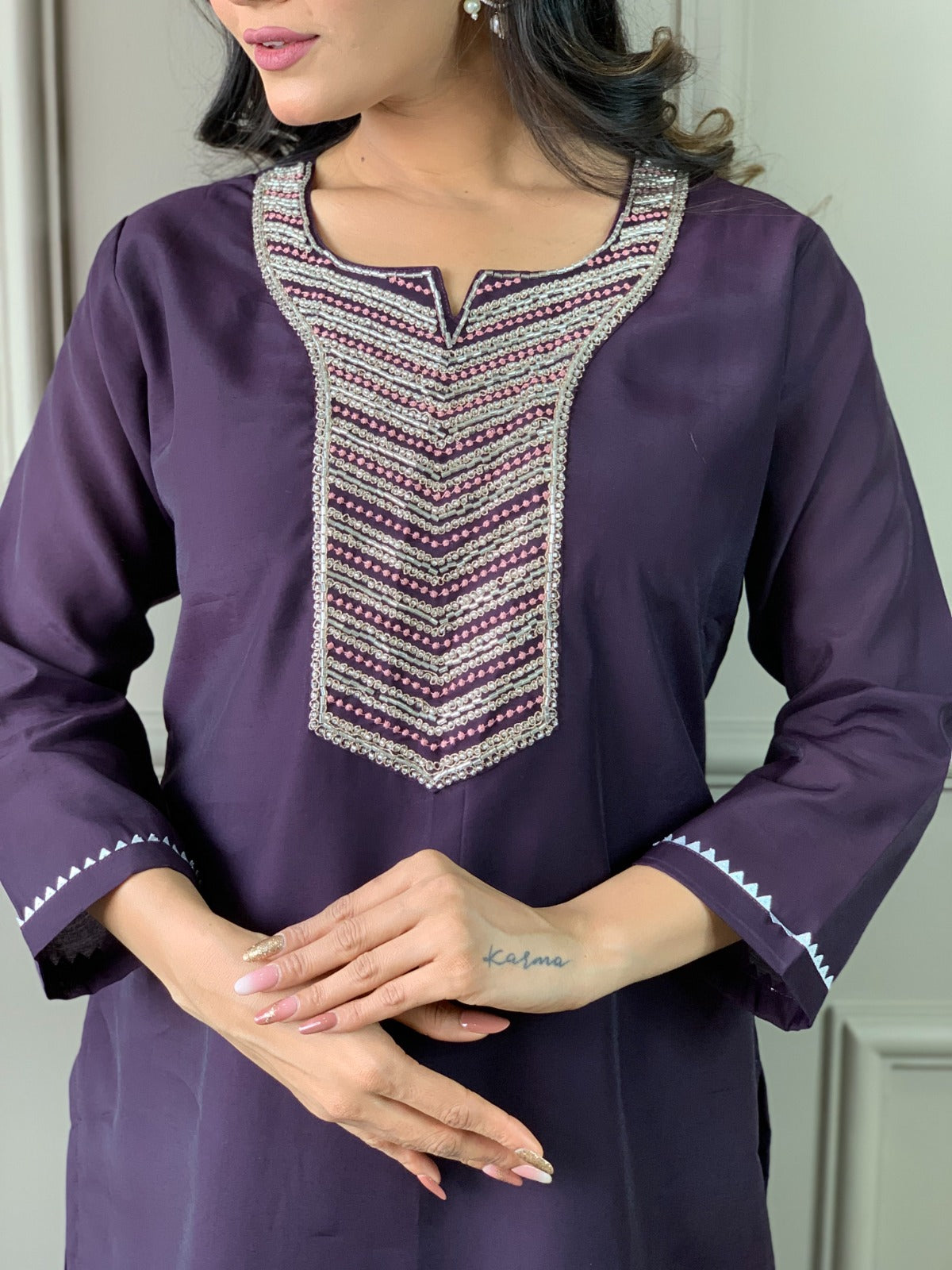 Exude elegance in this deep plum kurti set, featuring exquisite embroidery and a rich gold-detailed dupatta