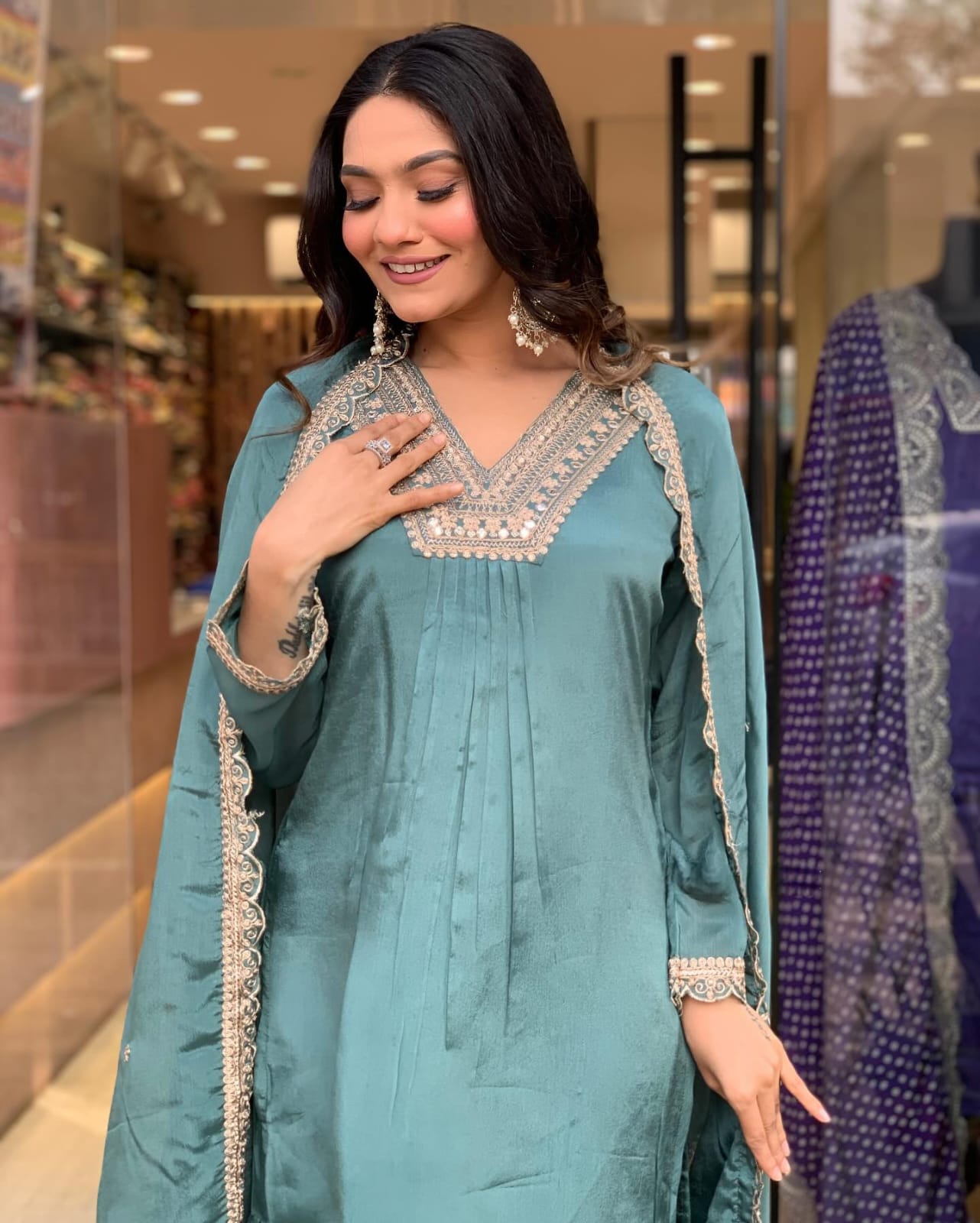 Elevate your style with this elegant teal kurti set, featuring intricate embroidery, delicate lacework, and a flowy silhouette