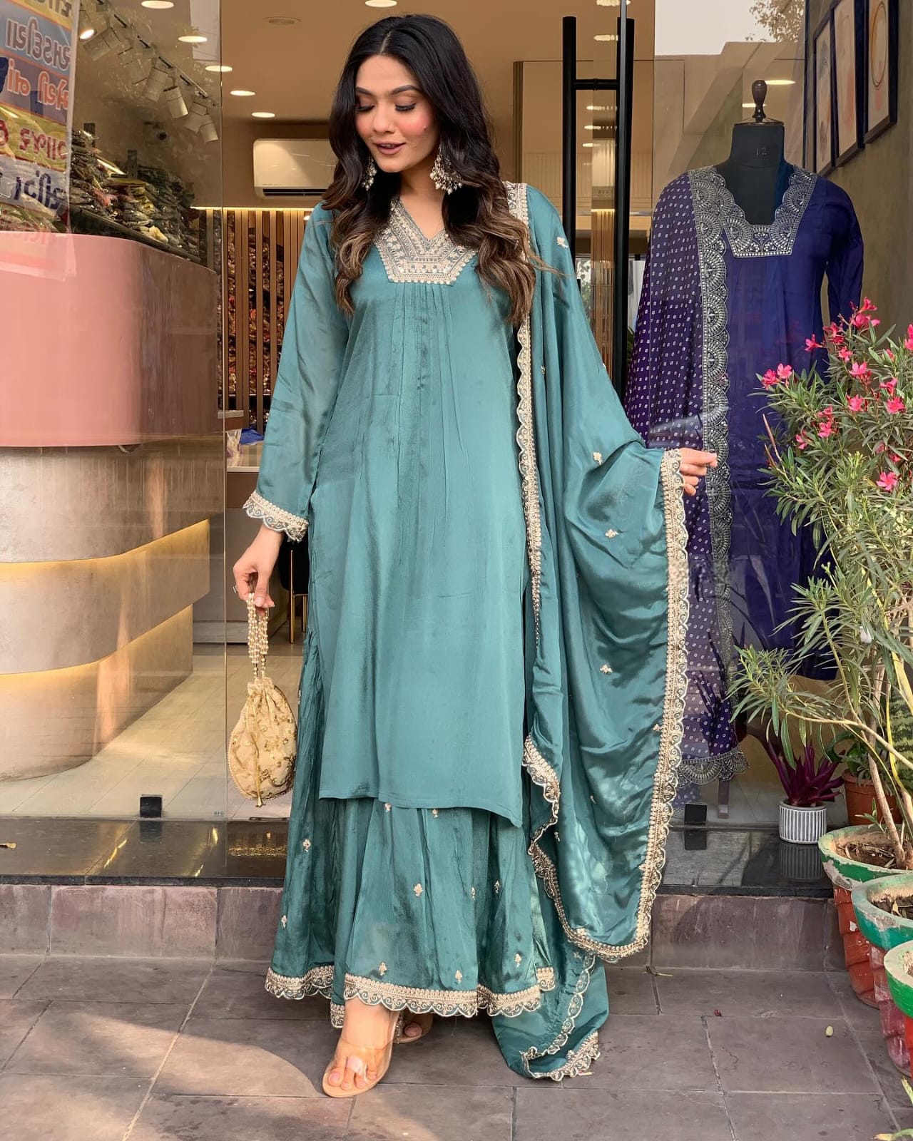 Elevate your style with this elegant teal kurti set, featuring intricate embroidery, delicate lacework, and a flowy silhouette