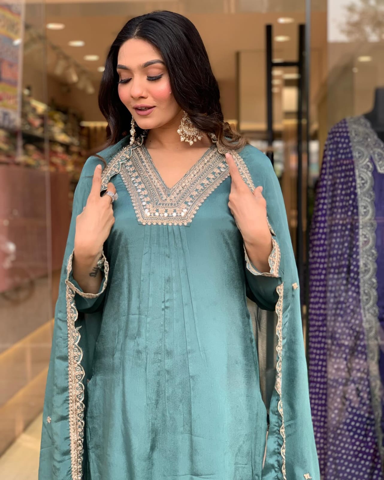 Elevate your style with this elegant teal kurti set, featuring intricate embroidery, delicate lacework, and a flowy silhouette