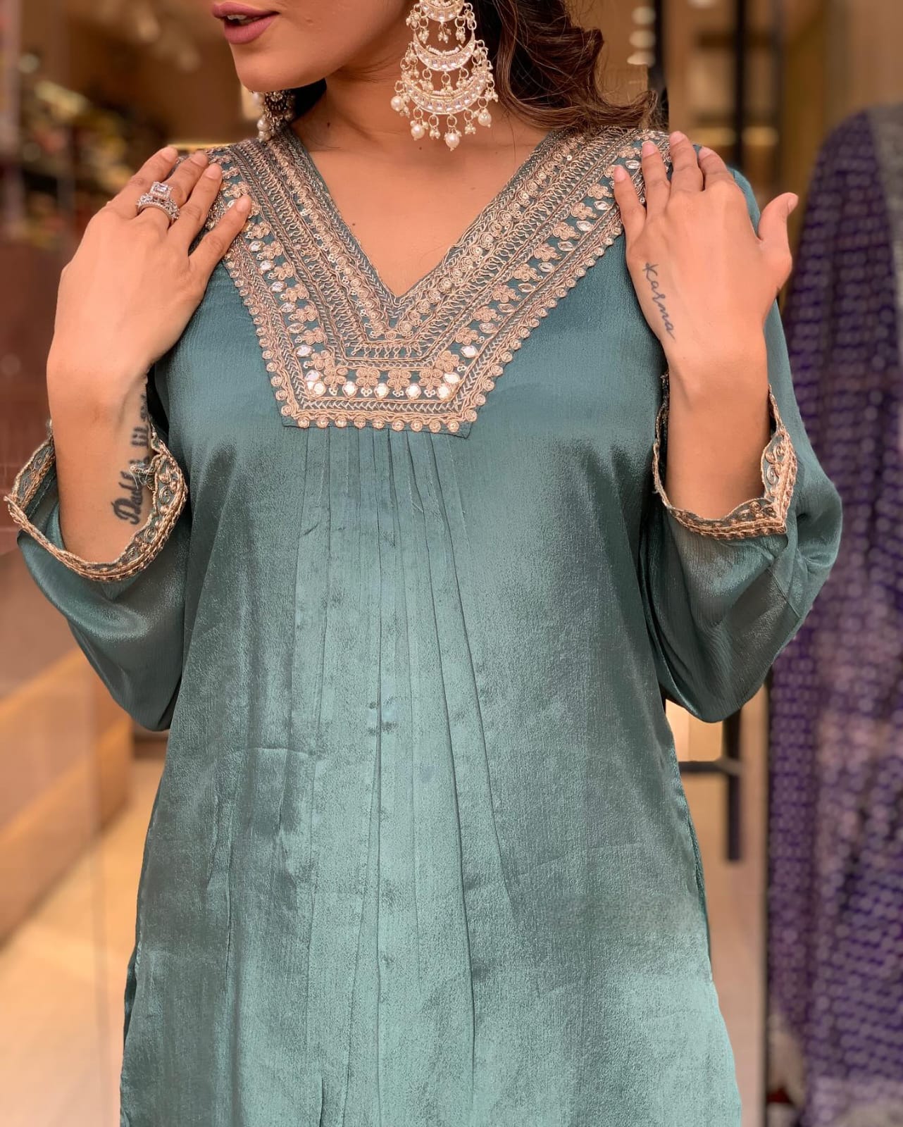 Elevate your style with this elegant teal kurti set, featuring intricate embroidery, delicate lacework, and a flowy silhouette