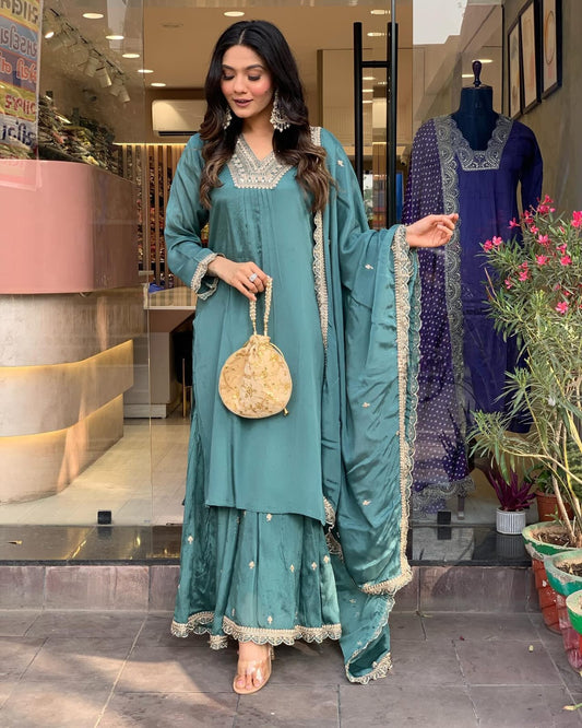 Elevate your style with this elegant teal kurti set, featuring intricate embroidery, delicate lacework, and a flowy silhouette
