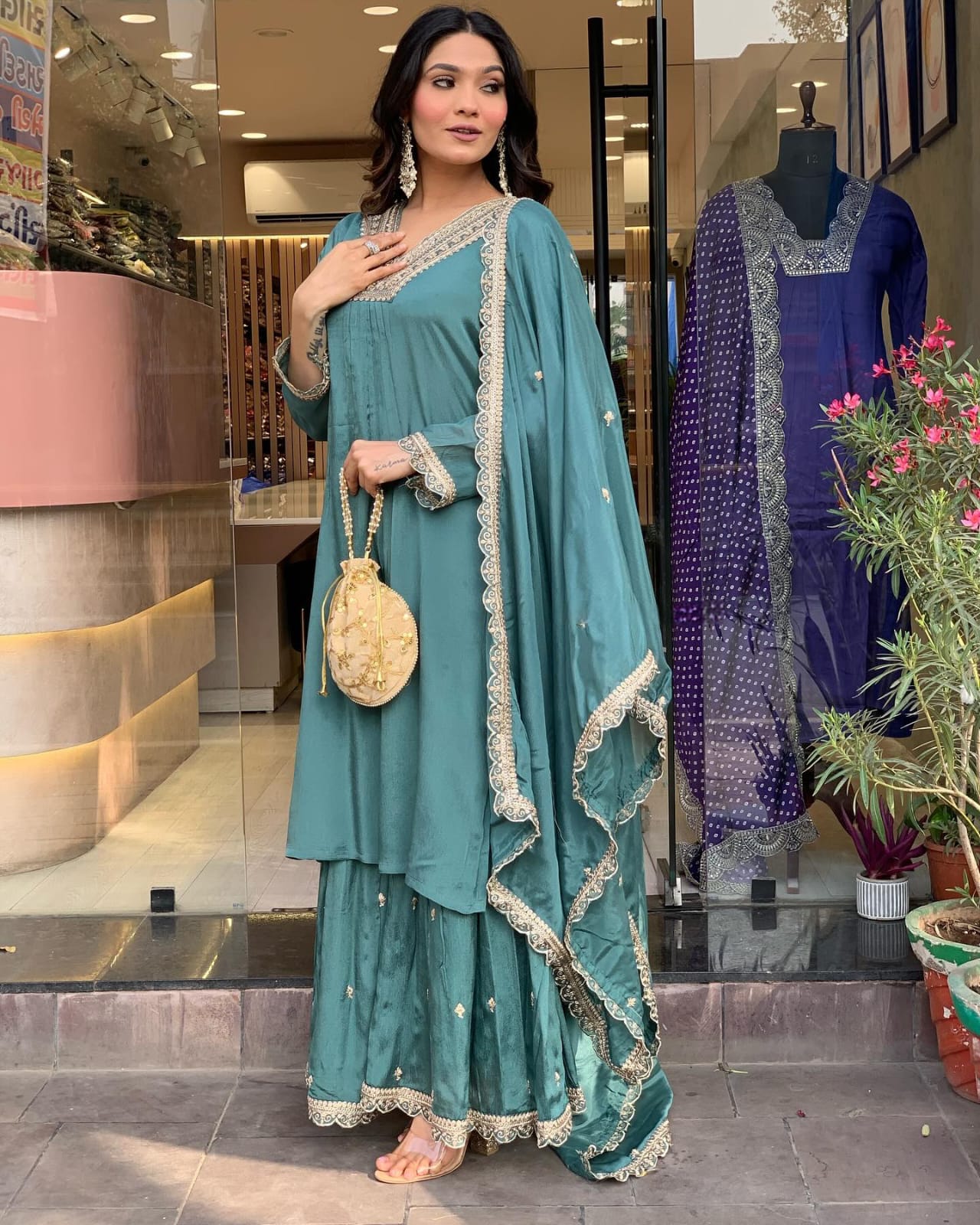 Elevate your style with this elegant teal kurti set, featuring intricate embroidery, delicate lacework, and a flowy silhouette