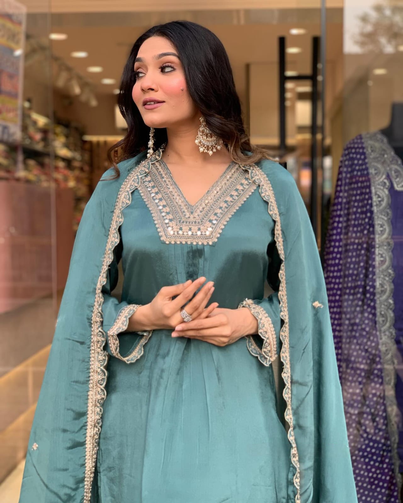 Elevate your style with this elegant teal kurti set, featuring intricate embroidery, delicate lacework, and a flowy silhouette