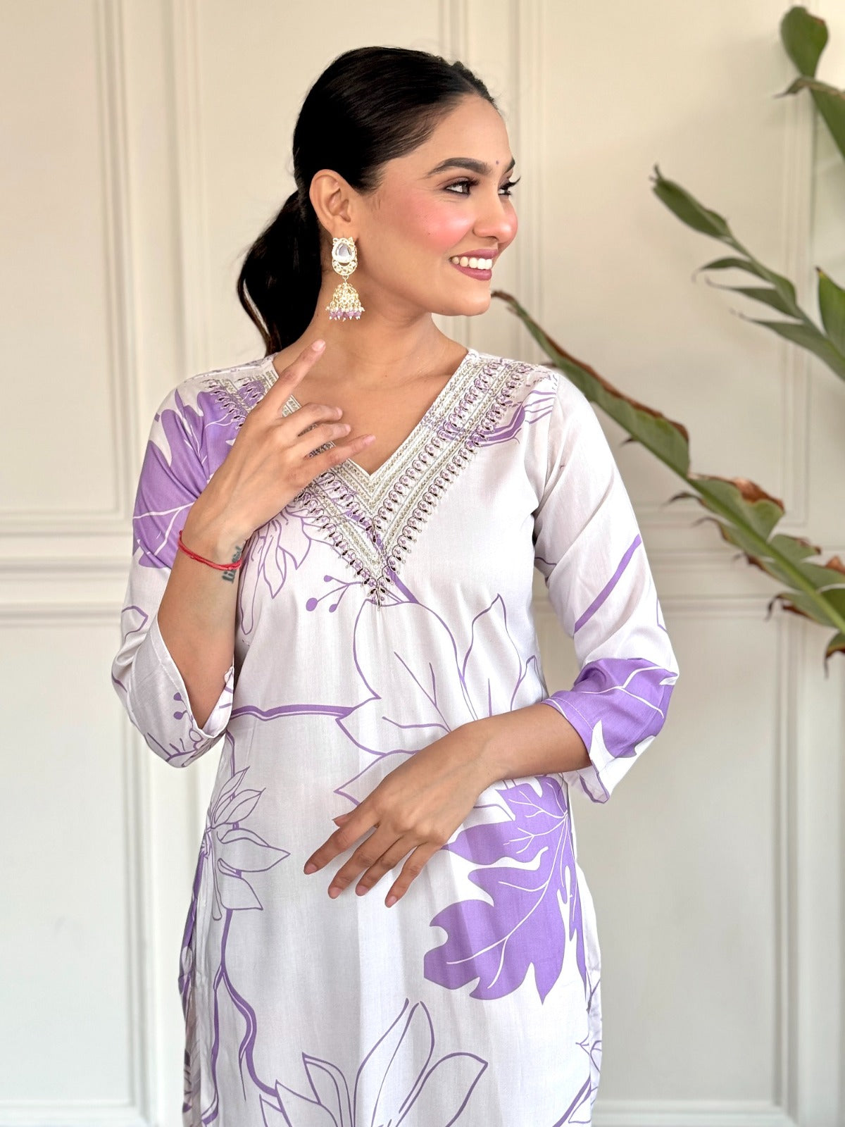 Step into effortless elegance with this soft lavender and white kurti set