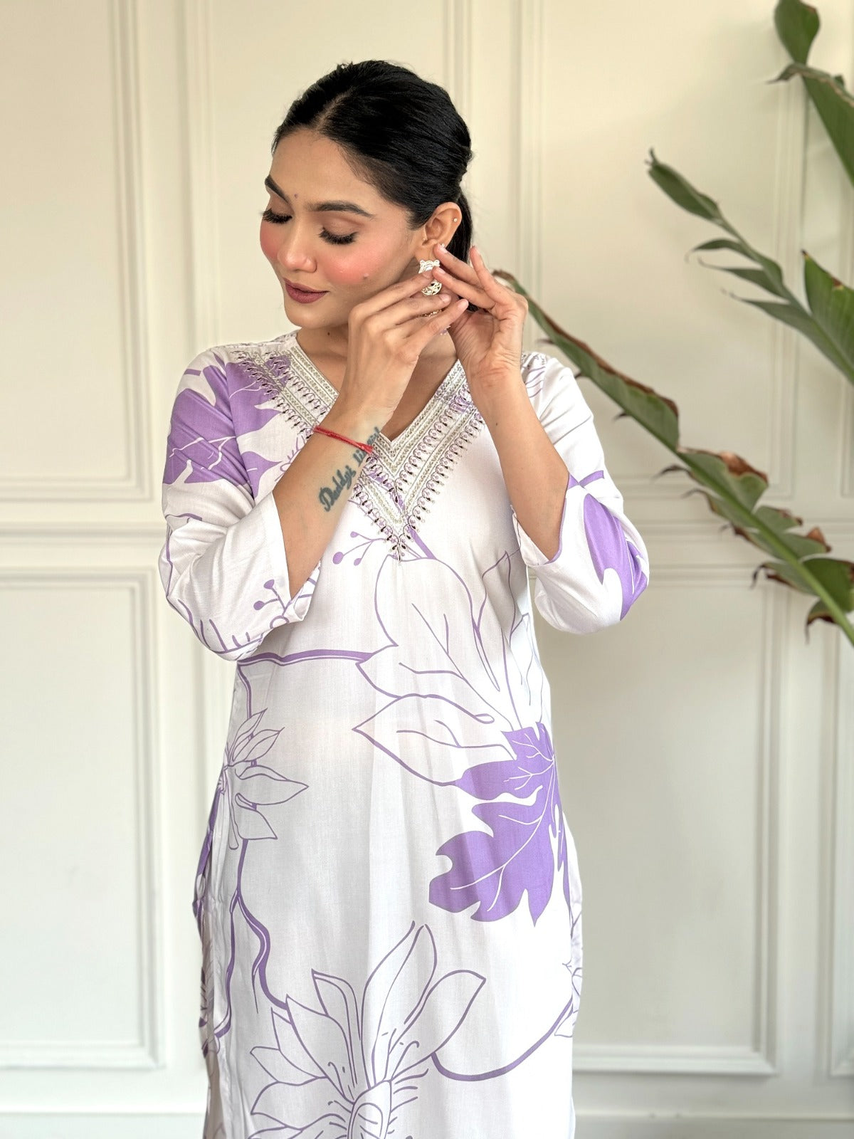 Step into effortless elegance with this soft lavender and white kurti set