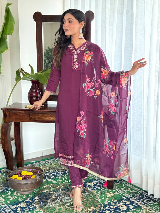 Embrace elegance with this rich plum kurti set, featuring intricate lace detailing and vibrant floral prints