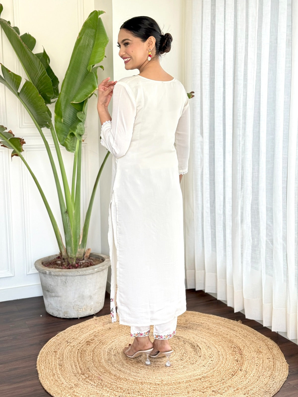 Step into elegance with this pristine white kurti set, beautifully adorned with delicate floral embroidery
