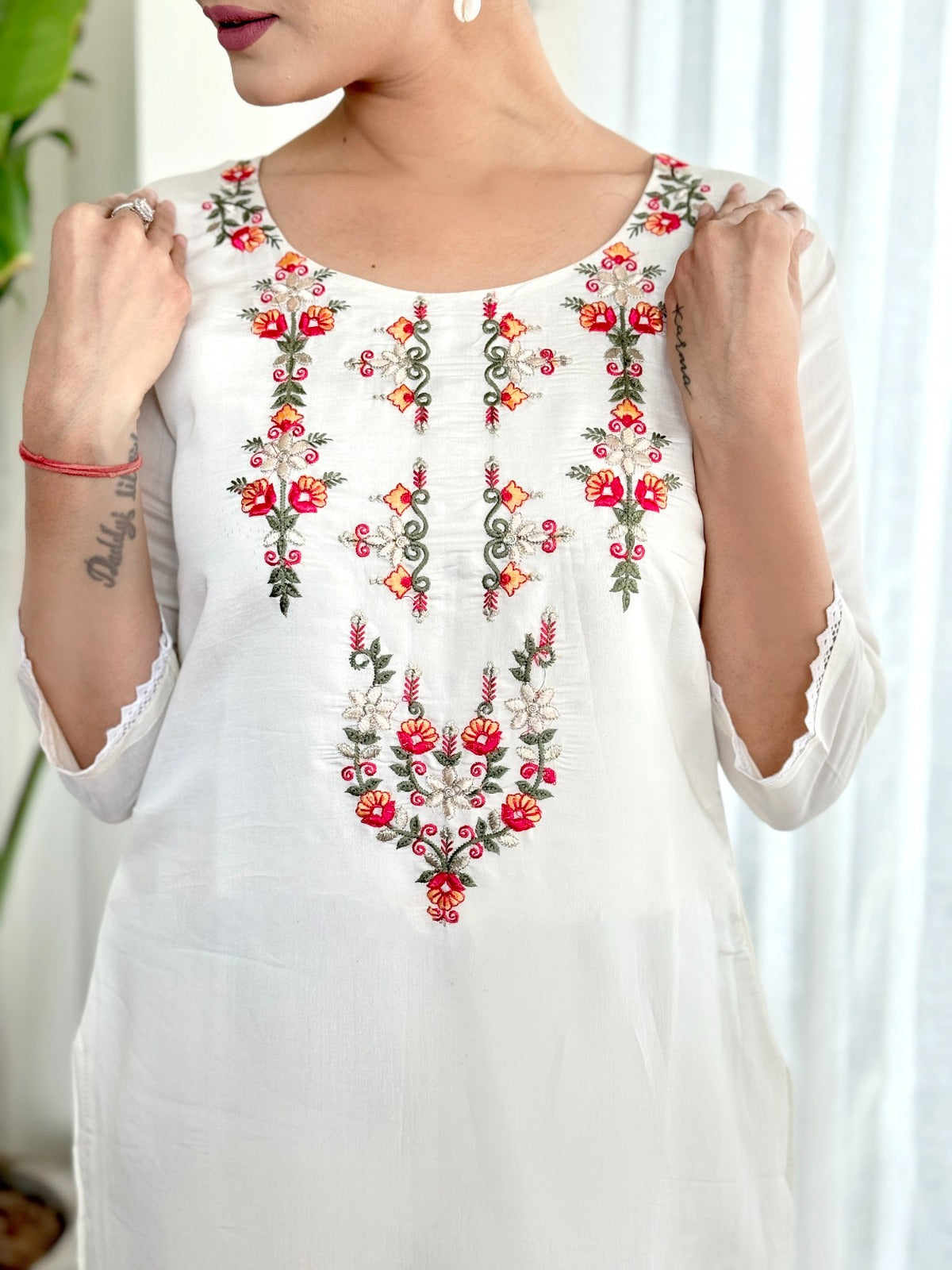 Step into elegance with this pristine white kurti set, beautifully adorned with delicate floral embroidery