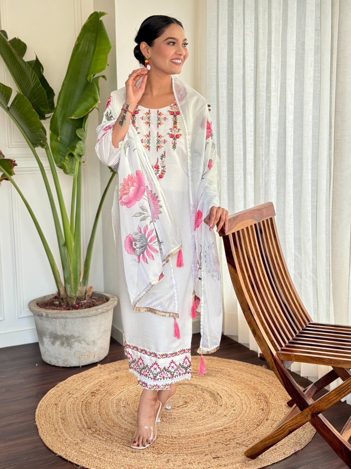 Step into elegance with this pristine white kurti set, beautifully adorned with delicate floral embroidery