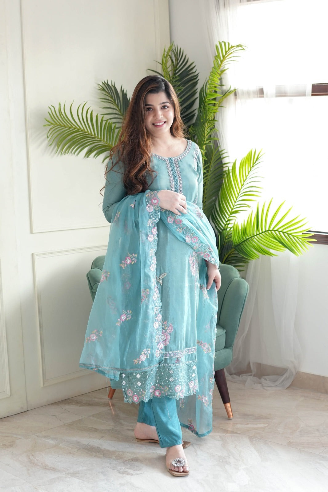 This stunning aqua blue kurti set is crafted with intricate floral embroidery, delicate embellishments, and a sheer dupatta for an elegant finish