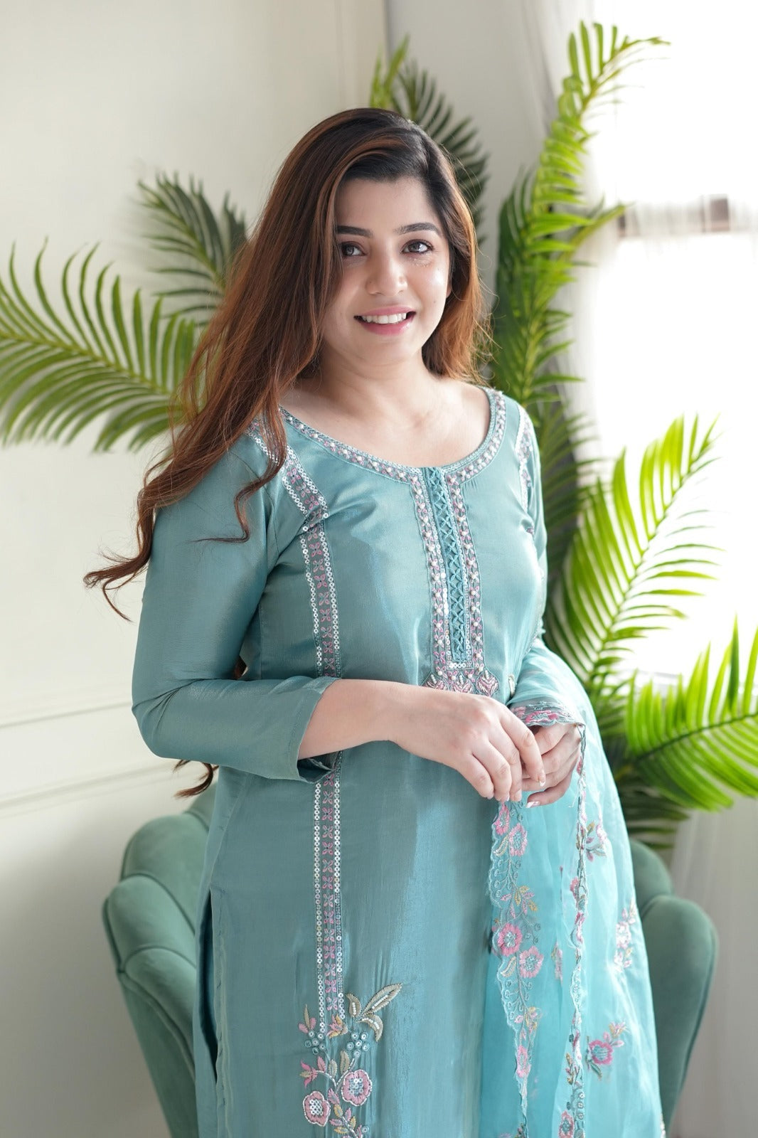 This stunning aqua blue kurti set is crafted with intricate floral embroidery, delicate embellishments, and a sheer dupatta for an elegant finish