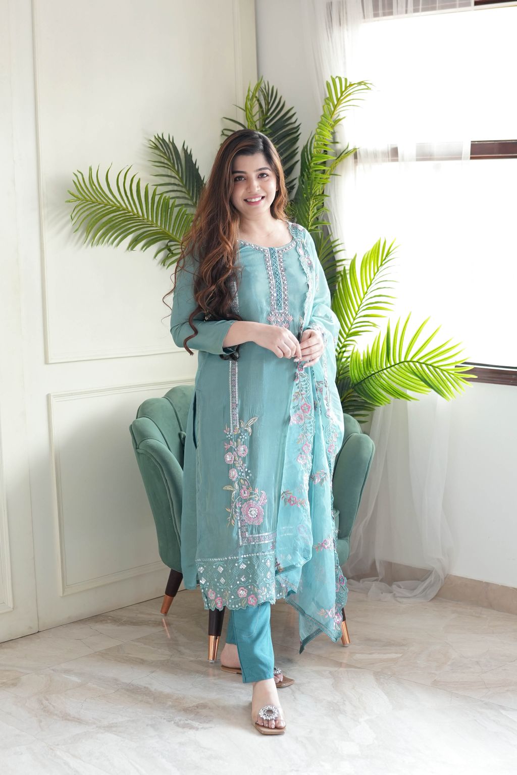This stunning aqua blue kurti set is crafted with intricate floral embroidery, delicate embellishments, and a sheer dupatta for an elegant finish