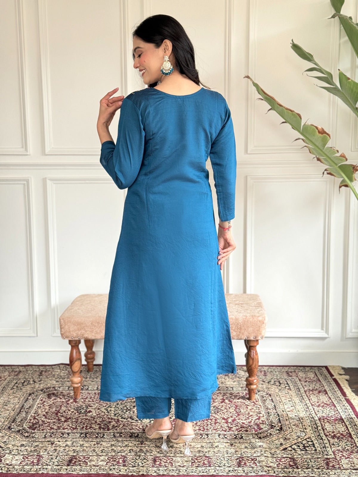 "Make a statement in this gorgeous teal blue kurti set, adorned with intricate embroidery and delicate detailing
