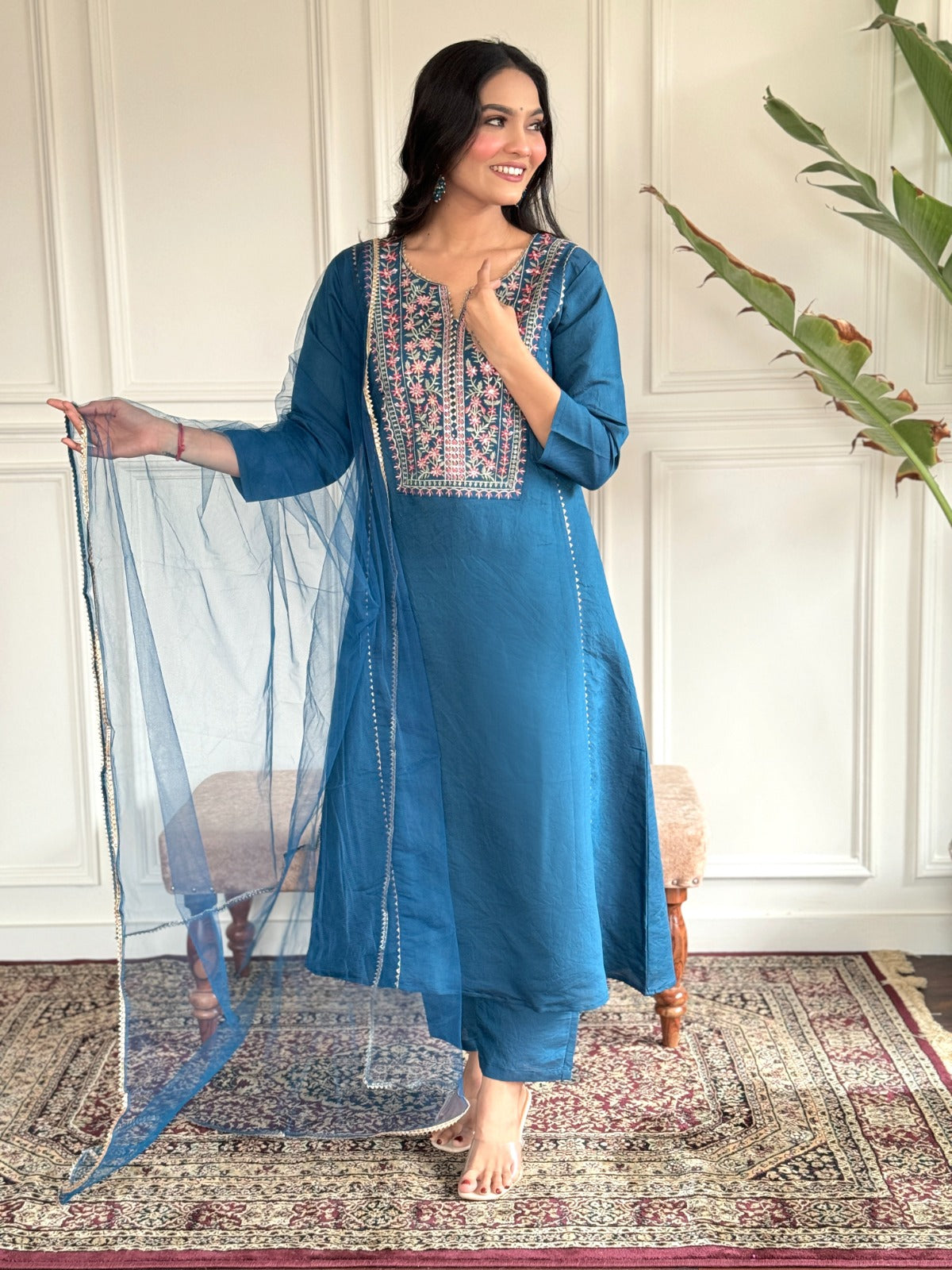 "Make a statement in this gorgeous teal blue kurti set, adorned with intricate embroidery and delicate detailing