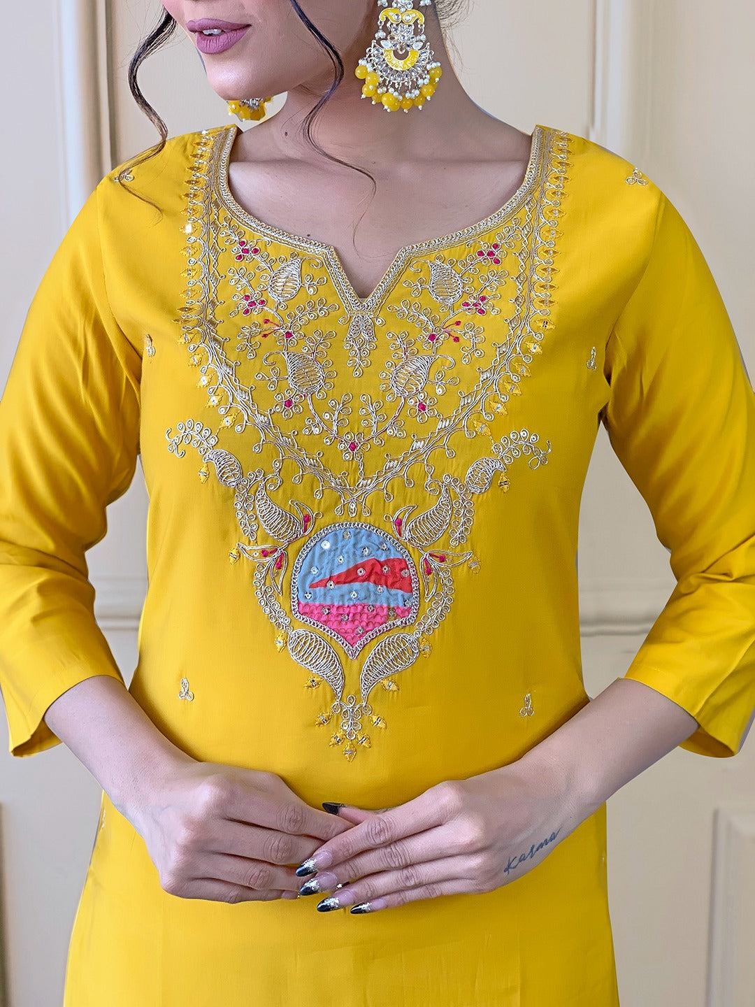 Brighten up your wardrobe with this radiant yellow kurti set, featuring delicate embroidery and a vibrant multicolored dupatta