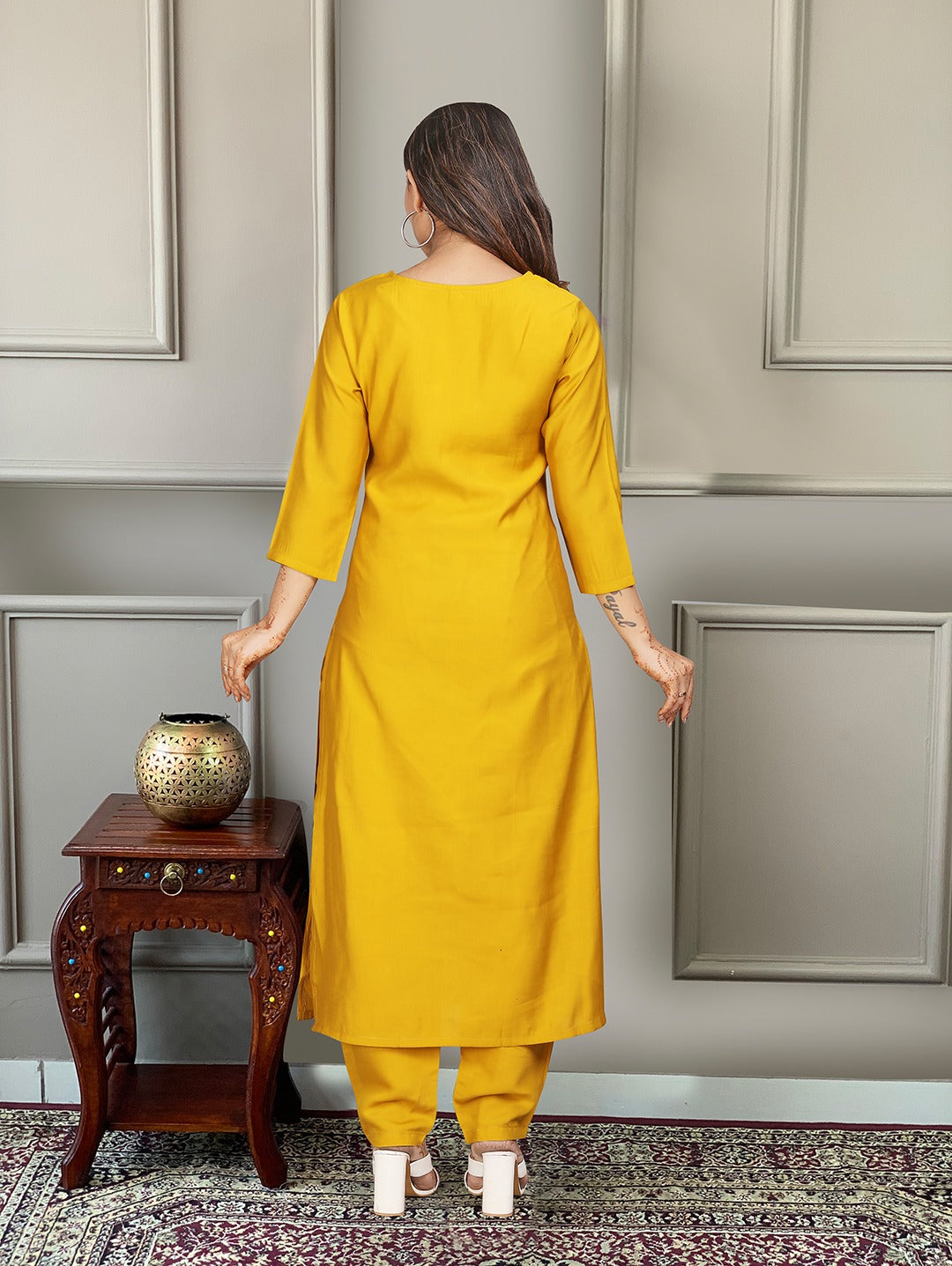 Brighten up your wardrobe with this radiant yellow kurti set, featuring delicate embroidery and a vibrant multicolored dupatta