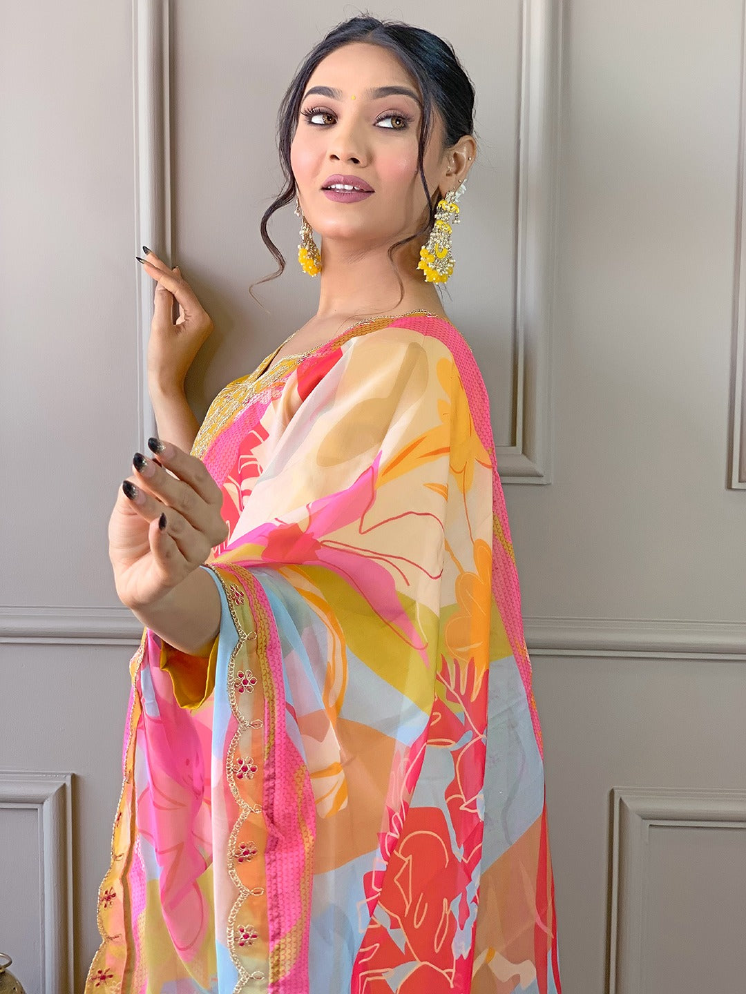 Brighten up your wardrobe with this radiant yellow kurti set, featuring delicate embroidery and a vibrant multicolored dupatta