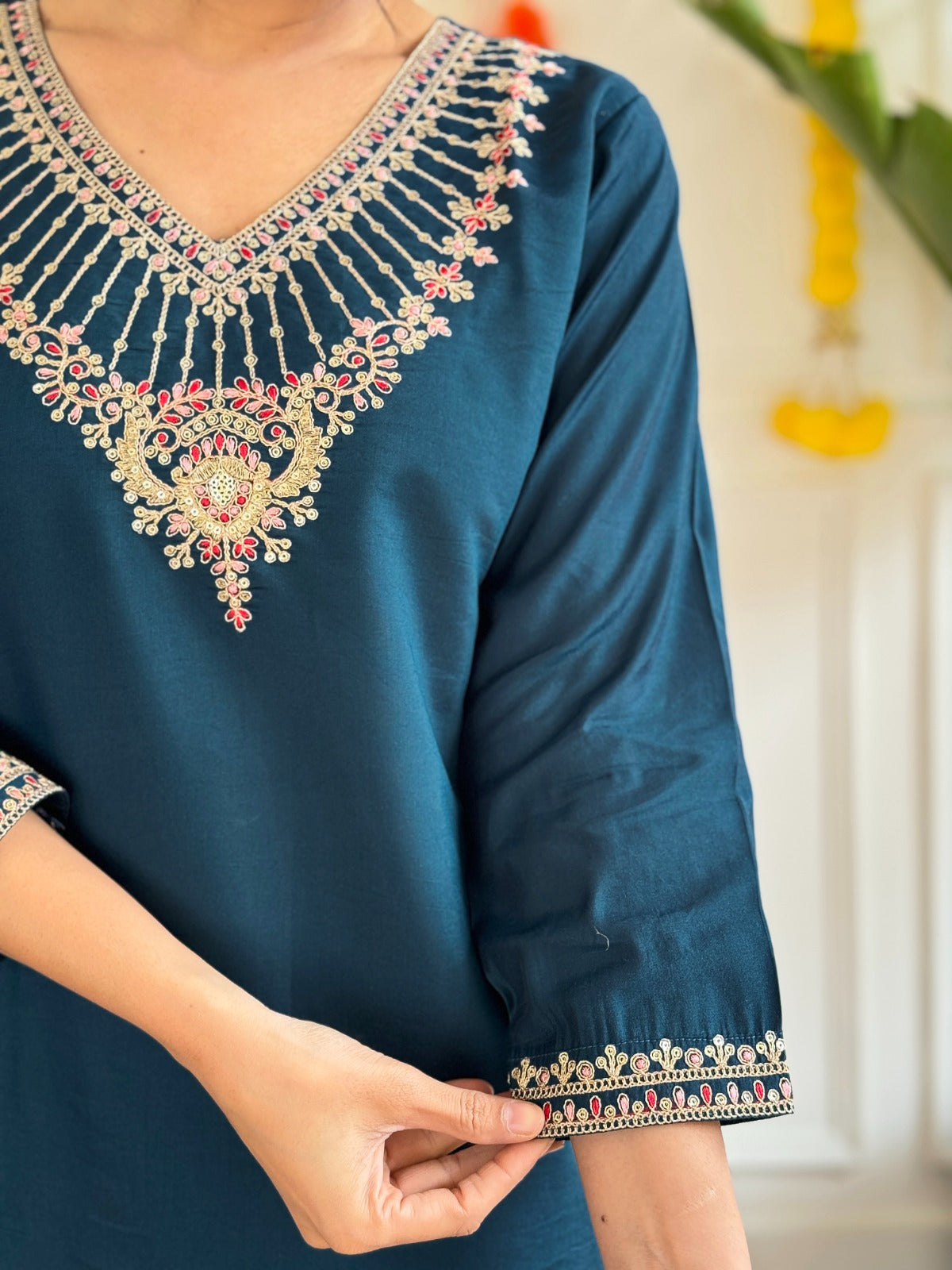 Step into elegance with this stunning deep teal kurti set, adorned with exquisite embroidery and a graceful sheer dupatta