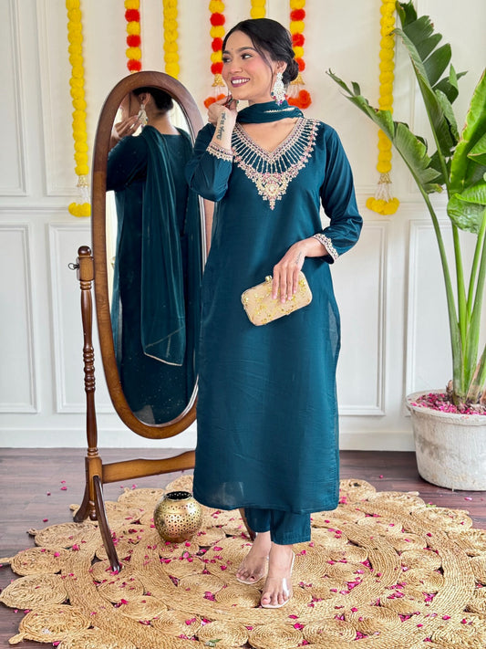 Step into elegance with this stunning deep teal kurti set, adorned with exquisite embroidery and a graceful sheer dupatta