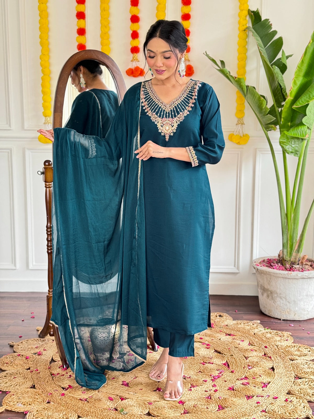 Step into elegance with this stunning deep teal kurti set, adorned with exquisite embroidery and a graceful sheer dupatta