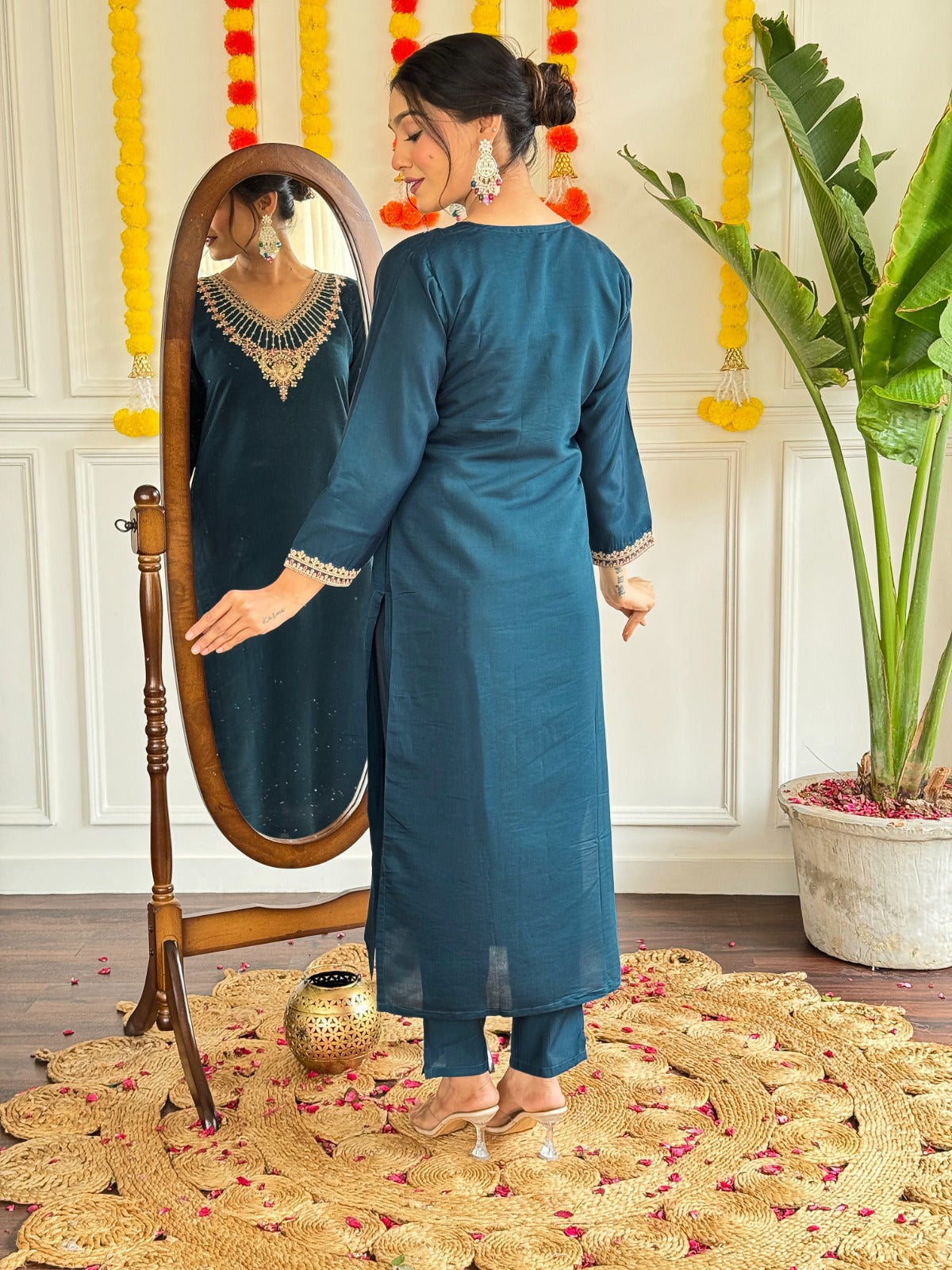 Step into elegance with this stunning deep teal kurti set, adorned with exquisite embroidery and a graceful sheer dupatta