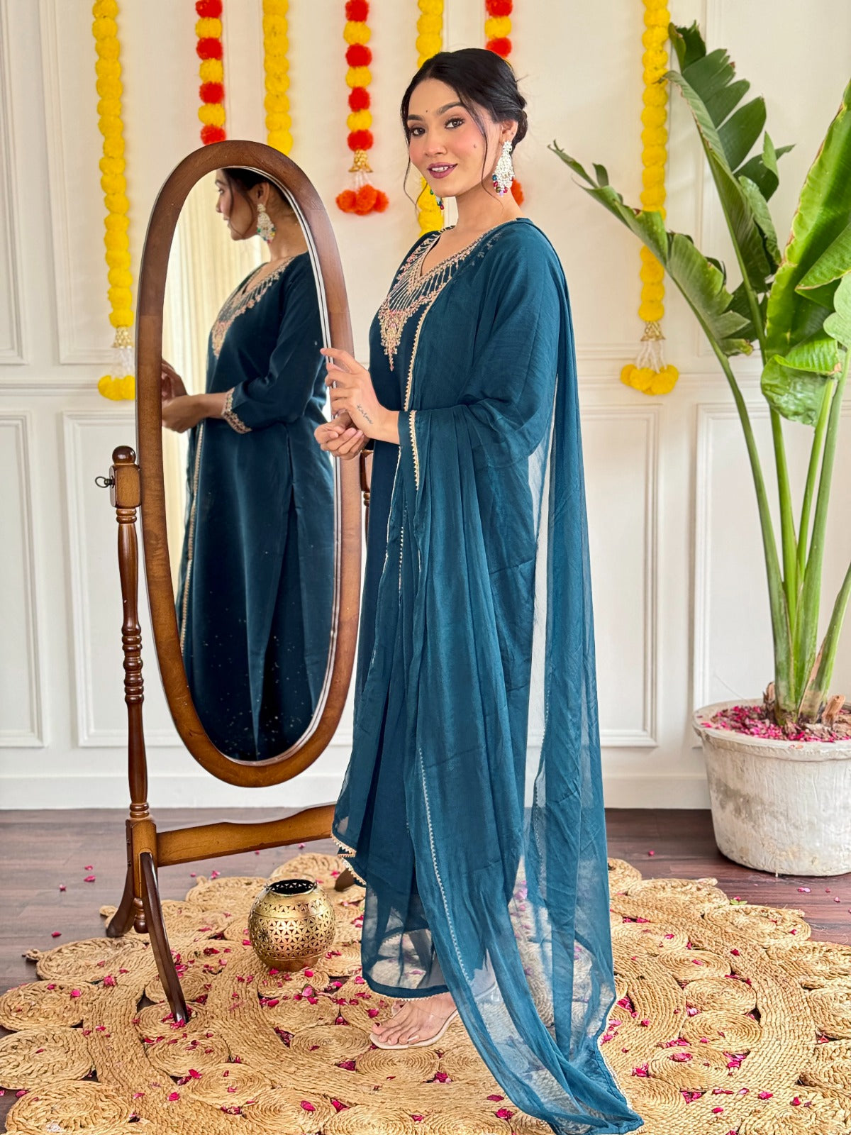 Step into elegance with this stunning deep teal kurti set, adorned with exquisite embroidery and a graceful sheer dupatta