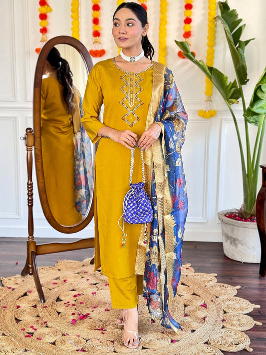 Embrace timeless elegance with this mustard yellow kurti set, featuring delicate embroidery and a regal blue floral dupatta