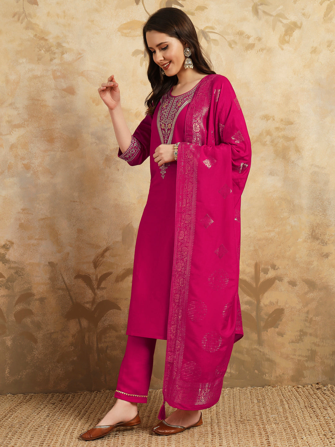 Radiate grace in this stunning magenta kurti set, adorned with intricate embroidery and delicate golden accents